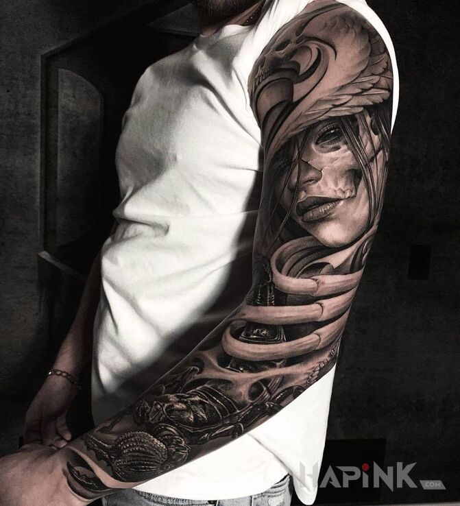 Tattoo Czarny skorpion in faces motif and realistic style on the upper arm