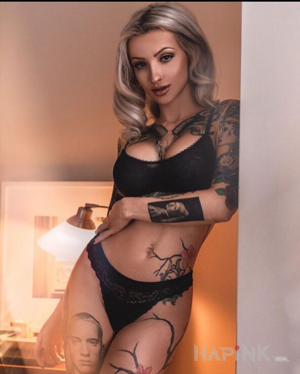 Tattoo Blondynka z eminemem in sexy motif and realistic style on the forearm