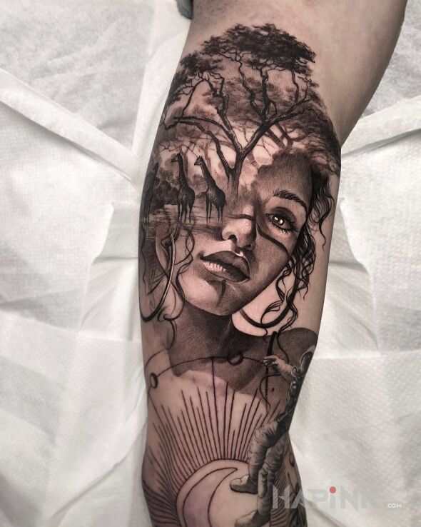 Tattoo Safari w głowie in faces motif and realistic style on the upper arm