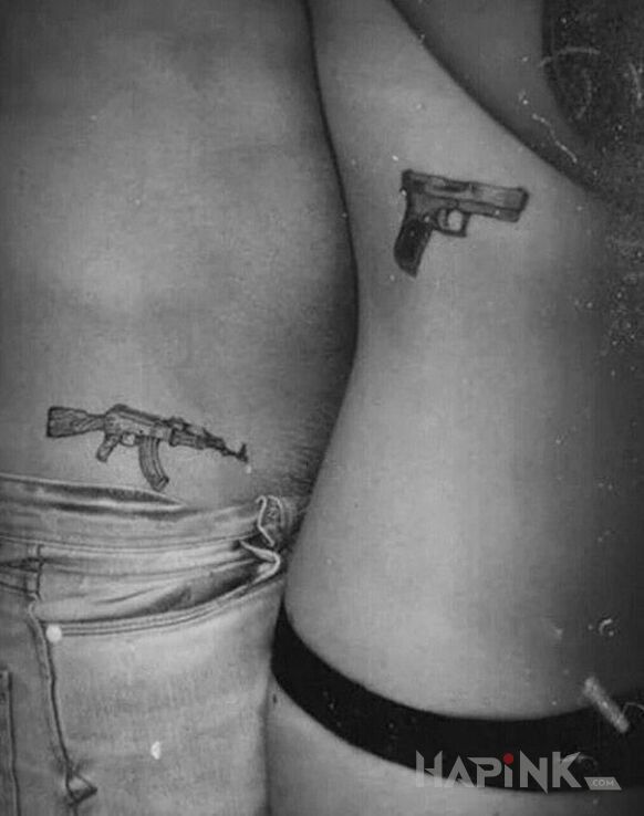 Tattoo On karabin ona pistolet in Love motif and graphic / illustrative style on the ribs