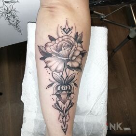 Tattoo Rose on the forearm motif: flowers style: graphic / illustrative