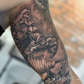 Tattoo Poseidon on the upper arm motif: characters style: realistic