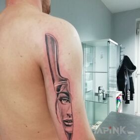 Tattoo Knife on triceps on the upper arm motif: faces style: graphic / illustrative