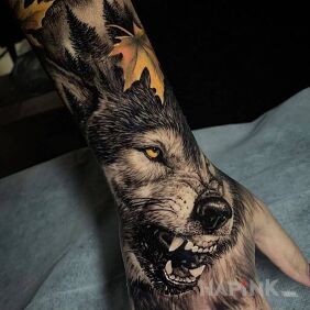Tattoo Wolf with fangs out on the forearm motif: 3D style: realistic