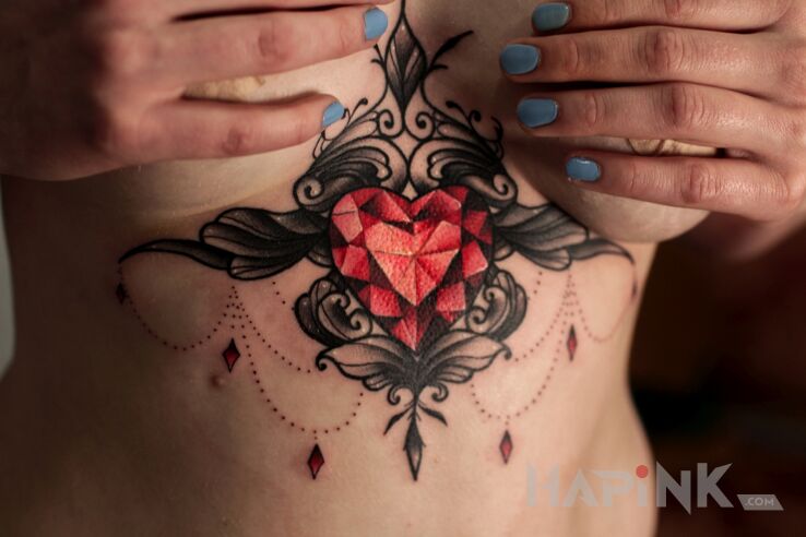 Tattoo Dziara między piersiami in ornaments motif and graphic / illustrative style on the stomach