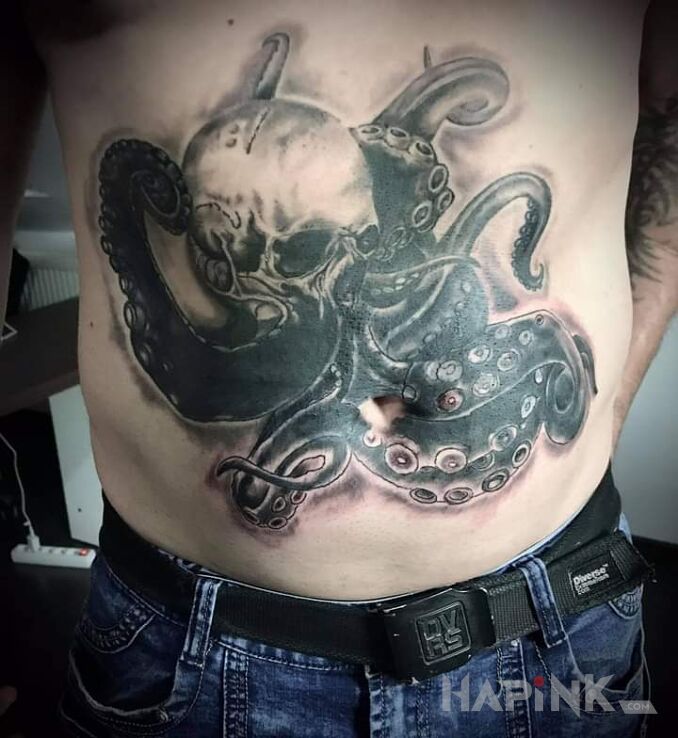 Tattoo Craken in skulls motif and graphic / illustrative style on the stomach