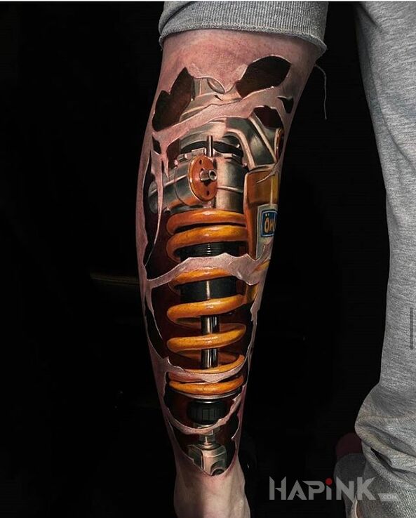 Tattoo Amortyzator in objects motif and biomechanics style on the calf