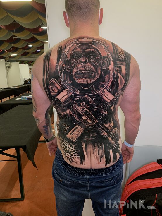 Tattoo Tattoo expo Rome 2020 in black and gray motif and realistic style on the back