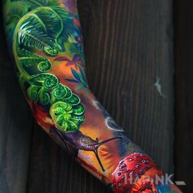 Tattoo Mega colorful on the upper arm motif: 3D style: realistic