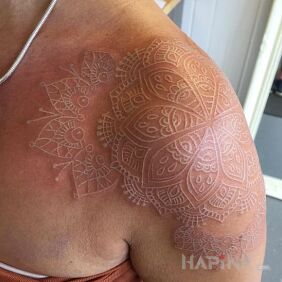 Tattoo Mandala number 3 on the upper arm motif: mandalas style: white ink