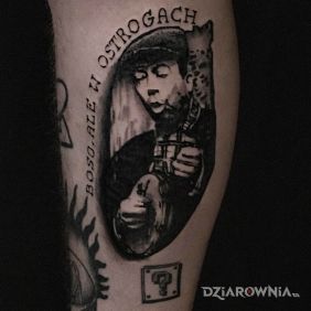 Tatuaż Stanisław Grzesiuk na łydce motyw: twarze styl: graficzne / ilustracyjne