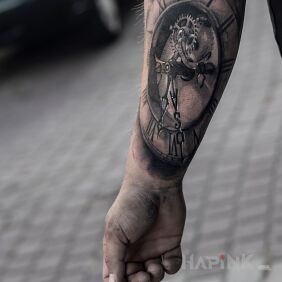 Tattoo Clock on the forearm motif: black and gray style: realistic