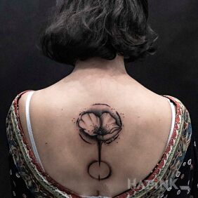 Tattoo Graphic flower on the back motif: black and gray style: graphic / illustrative