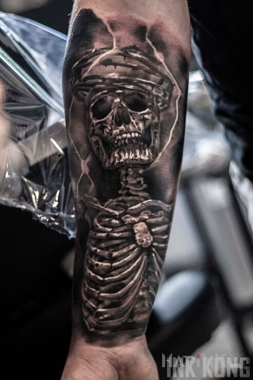 Tattoo Szkielet in black and gray motif and realistic style on the forearm