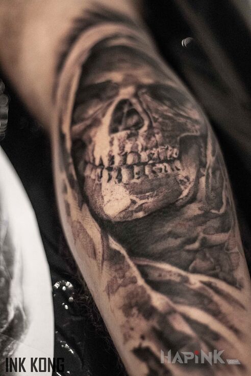 Tattoo Kostucha in black and gray motif and realistic style on the forearm