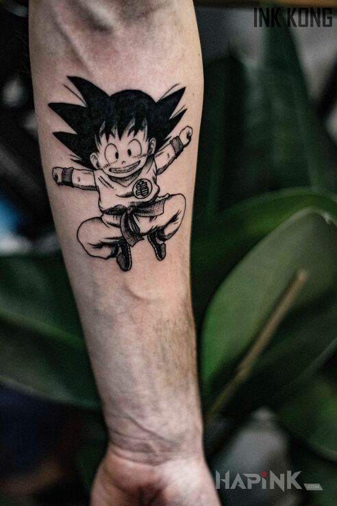 Tattoo Son Gokū in characters motif and cartoon / comic book style on the forearm