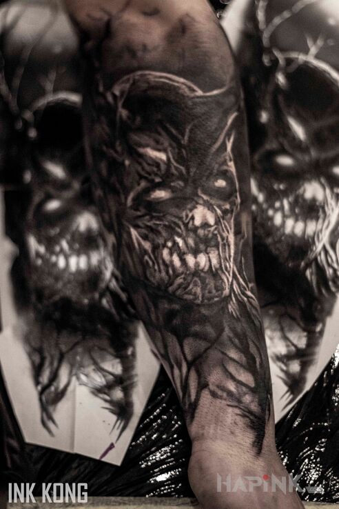 Tattoo Demon in dark motif and realistic style on the forearm