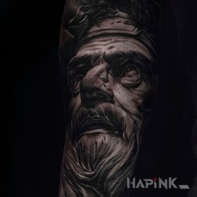 Tattoo Statue on the forearm motif: faces style: realistic