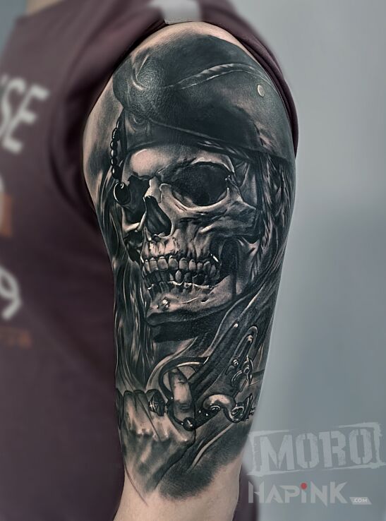Tattoo Pirate skull in 3D motif and realistic style on the upper arm