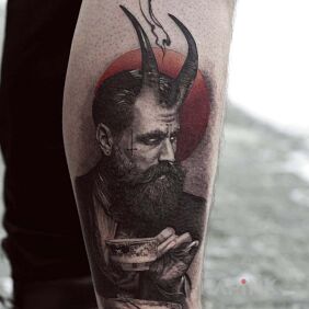 Tattoo Mephistotle on the calf motif: demons style: realistic
