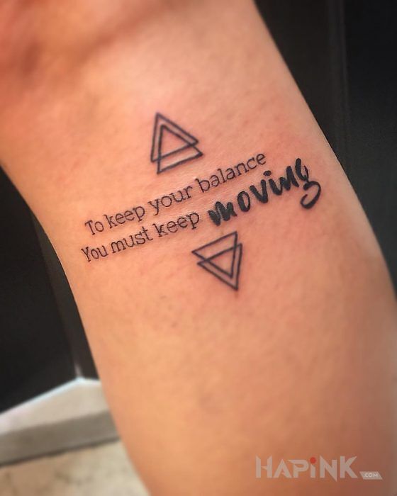 Tattoo Utrzymanie równowagi in lettering motif and calligraphy style on the forearm