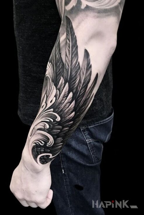 Tattoo Skrzydło na ręce in black and gray motif and realistic style on the forearm