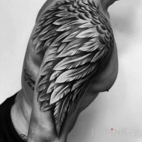 Tattoo One more wing on the upper arm motif: wings style: realistic
