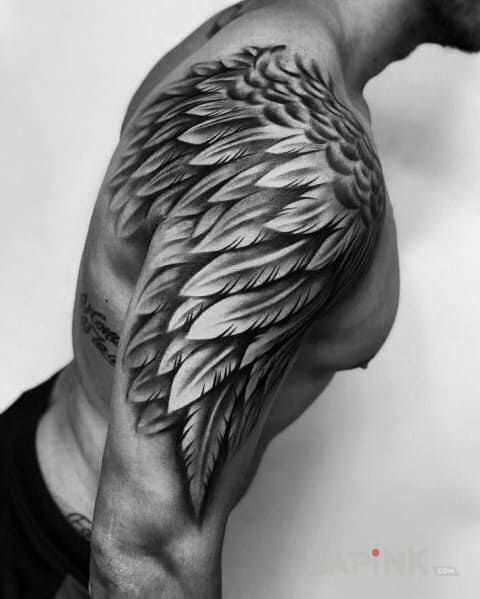 Tattoo Jeszcze jedno skrzydełko in wings motif and realistic style on the upper arm