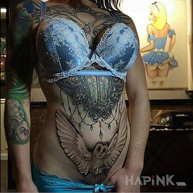 Tattoo Sowa na brzuchu in sexy motif on the chest