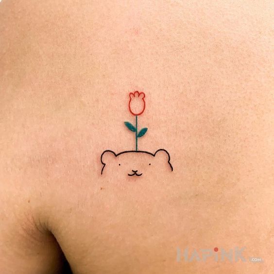 Tattoo Miś :) in flowers motif and contour / linework style on the shoulder blades