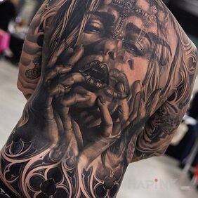 Tattoo Blurred face on the shoulder blades motif: black and gray style: realistic