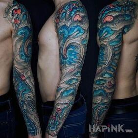 Tattoo Blue in the paw on the upper arm motif: colorful style: organic