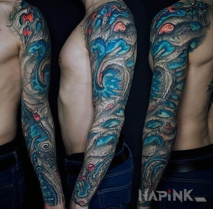 Tattoo Błękit w łapie in sleeves motif and organic style on the forearm