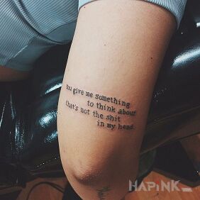 Tattoo Food for thought on the upper arm motif: lettering