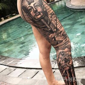 Tattoo Great Pharaoh on the calf motif: black and gray style: realistic