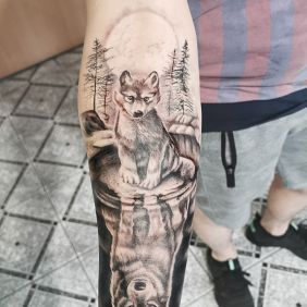 Tattoo Wolves on the forearm motif: animals style: realistic