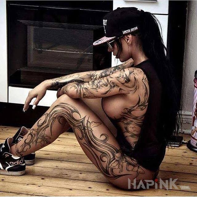 Tattoo Laska z tribalami in sexy motif on the forearm