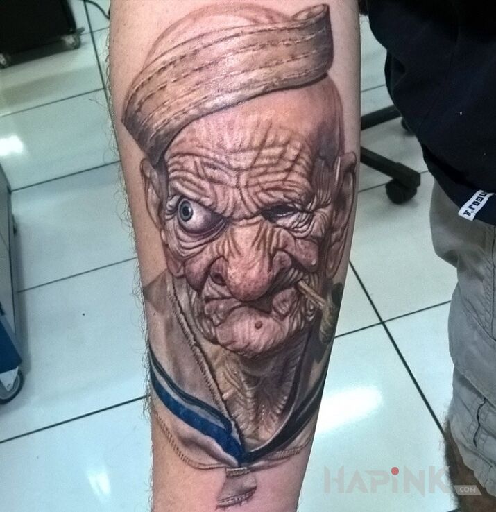 Tattoo Popeye in characters motif and realistic style on the forearm