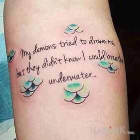 Tattoo Breathing underwater on the forearm motif: lettering style: calligraphy
