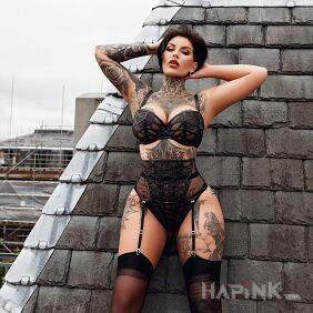 Tattoo Model in sexy lingerie on the forearm motif: flowers style: graphic / illustrative