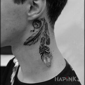 Tattoo A pen behind the ear behind the ear motif: black and gray style: realistic