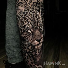 Tattoo Leopard on the calf motif: black and gray style: realistic