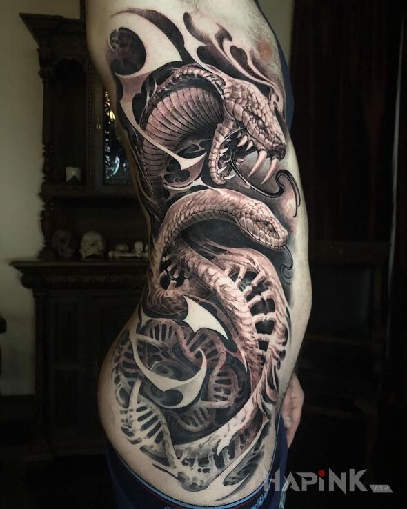 Tattoo Dwa węże in black and gray motif and realistic style on the buttocks