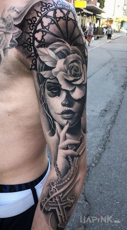 Tattoo Róża we włosach in santa muerte motif and realistic style on the upper arm