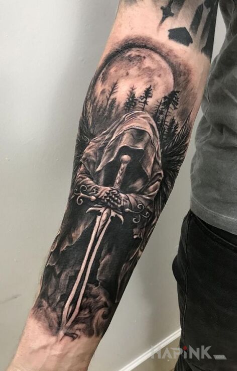 Tattoo Anioł zemsty in black and gray motif and realistic style on the forearm