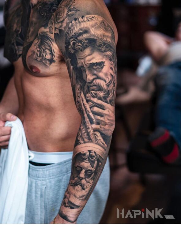 Tattoo Greckie twarze in black and gray motif and realistic style on the forearm
