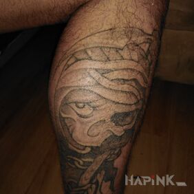 Tattoo Kostucha on the calf motif: black and gray style: graphic / illustrative
