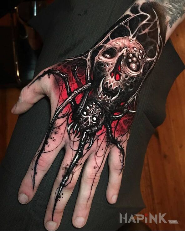 Tattoo Mroczny pąjączek in black and gray motif and graphic / illustrative style on the hand
