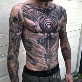 Tattoo Human robot on the upper arm motif: black and gray style: realistic