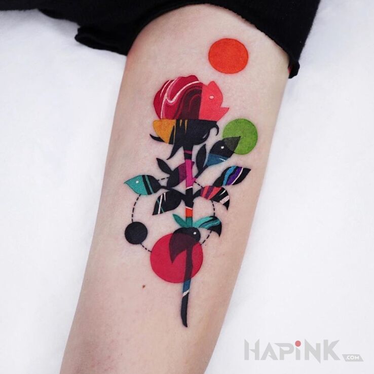 Tattoo Fikuśna róża in colorful motif and abstract style on the forearm